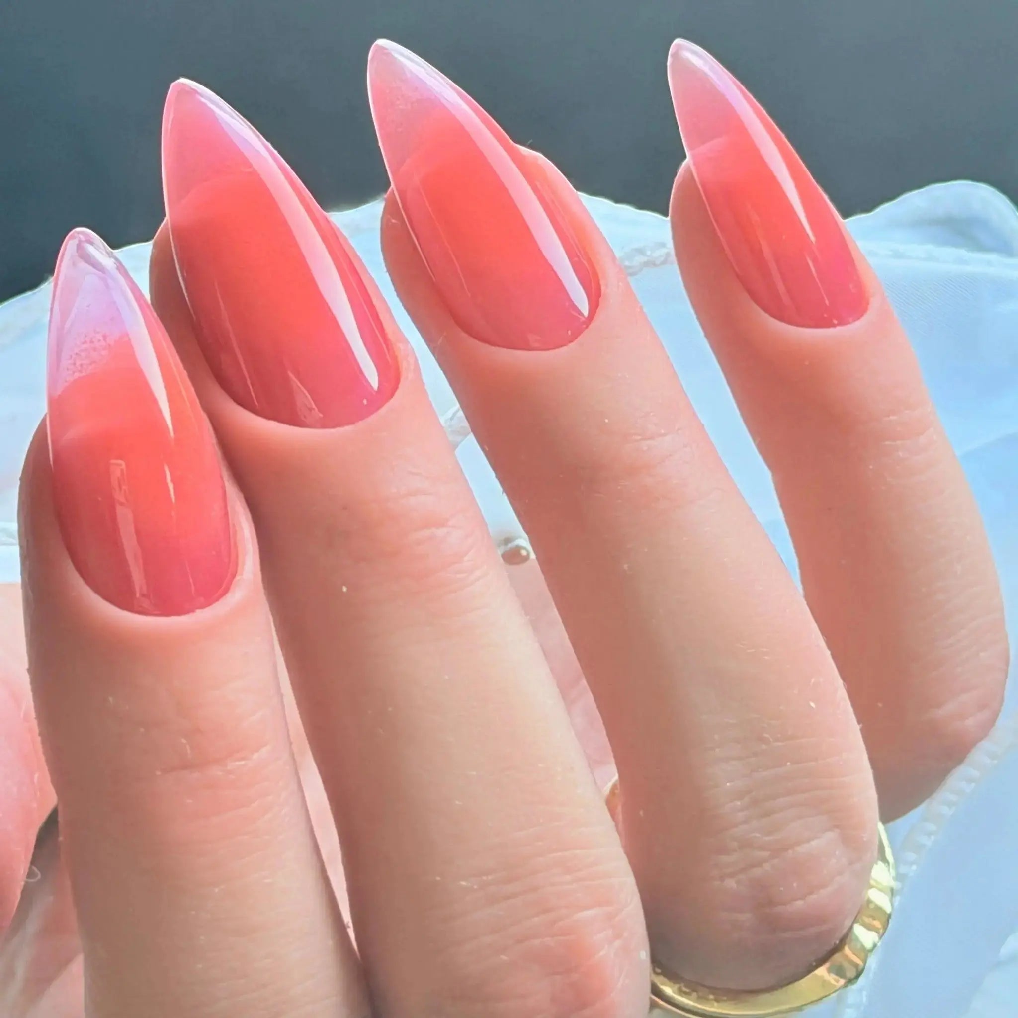 Press to Impress Sunset Syrup jelly nails with a juicy coral-pink hue, soft syrup gradients, and ultra glossy shine.