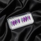 Press to Impress Violet Mirage stiletto press on nails with holographic glitter and butterfly accents.