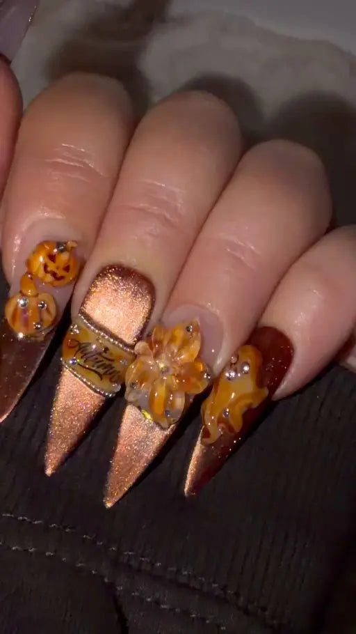 Pumpkin Hour handmade Halloween press-on nails with copper shimmer, sculptural pumpkins and stiletto tips
